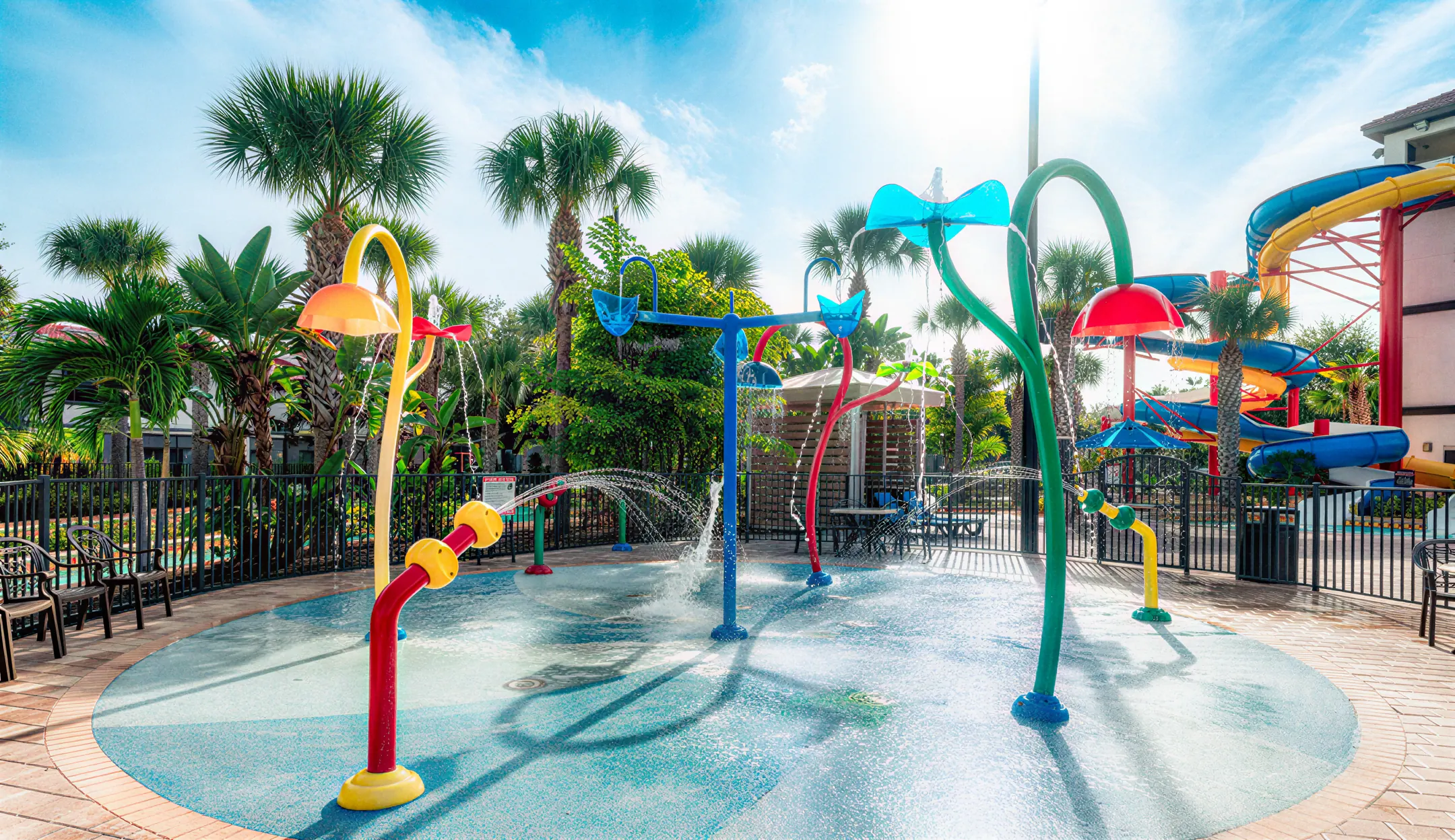 Colorful splash pad with sprayers and play structures